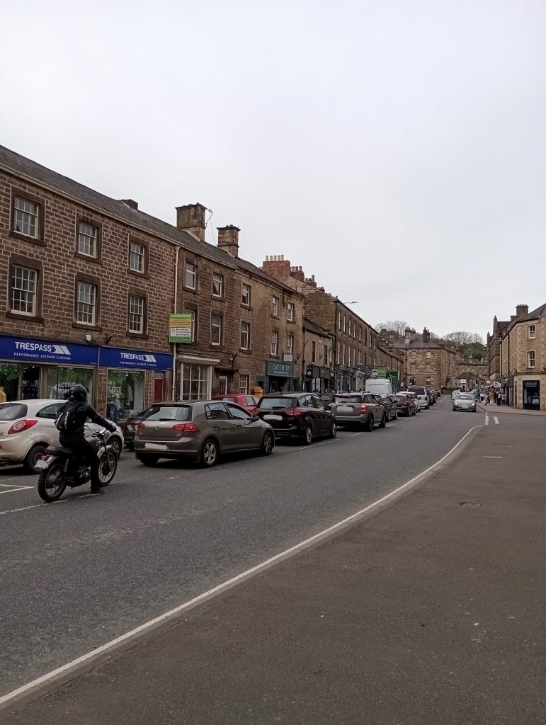 Cars queuing along a market town road